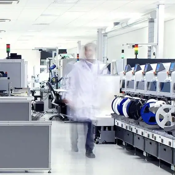  Fast-motion activity of an individual in an EMS factory, showcasing efficient manufacturing processes.
