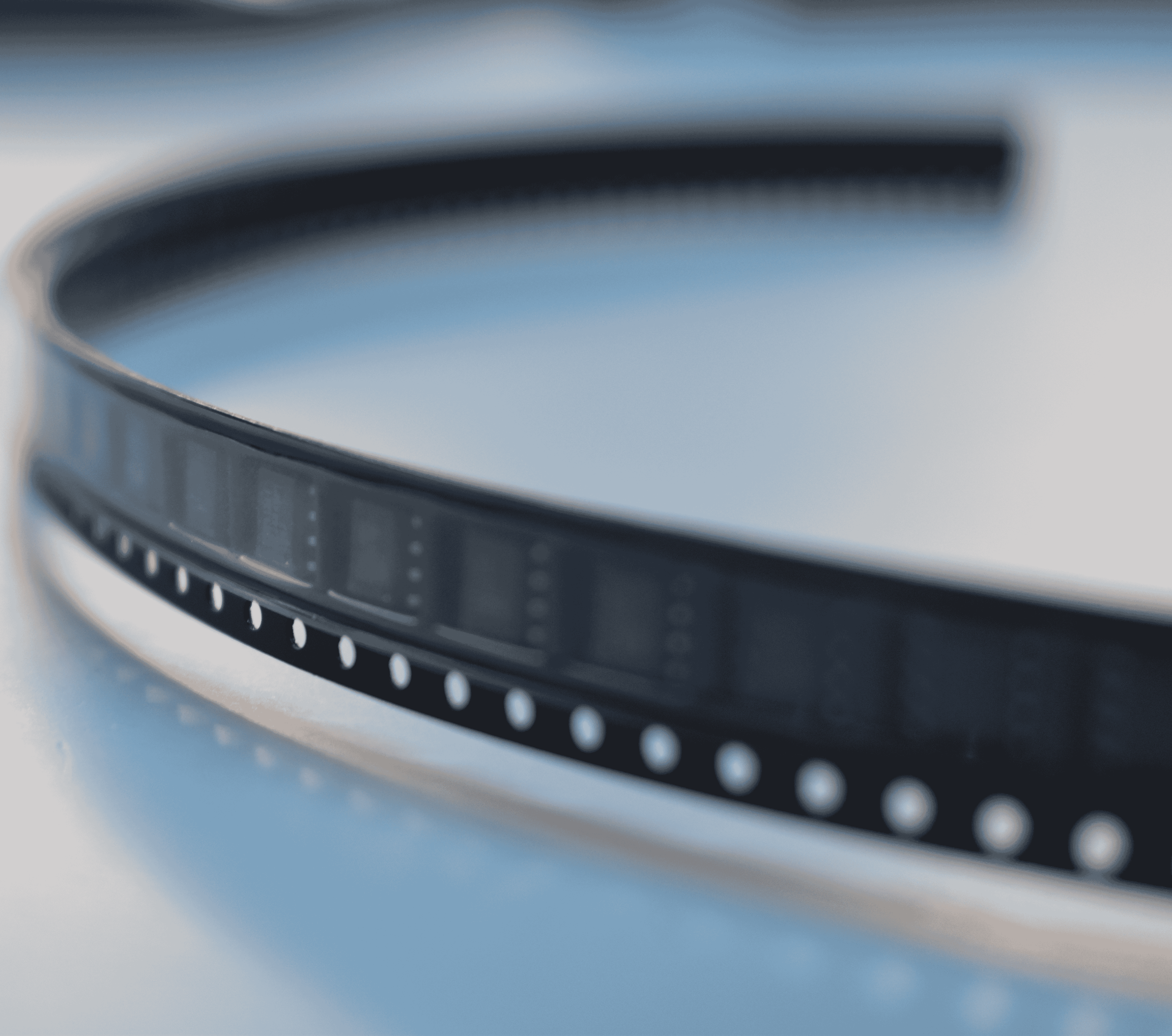 Photo of an electronic component reel with a blue backgroud.